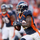 Kareem Jackson #22 of the Denver Broncos carries the ball after making an interception against the Tennessee Titans in the fourth quarter at Broncos Stadium at Mile High on October 13, 2019 in Denver, Colorado.